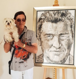 El pintor Jaume Queralt, amb el seu gosset